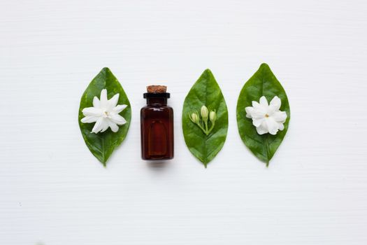 Essential oil with jasmine  flower on white background.