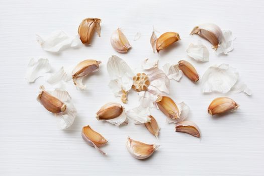 Garlic with rosemary and peppercorn isolated on white background. Top view