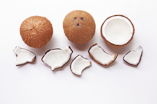 Coconuts on a white background. Top view.