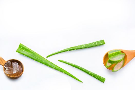 Aloe vera fresh leaves with aloe vera gel on wooden spoon. isolated on white