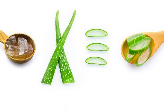 Aloe vera fresh leaves with aloe vera gel on wooden spoon. isolated on white