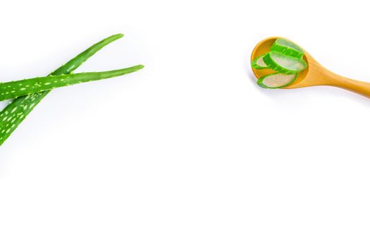 Aloe vera fresh leaves with aloe vera gel on wooden spoon. isolated on white