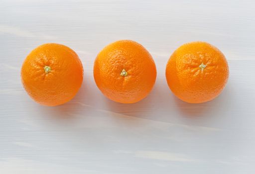 Fresh orange citrus fruit on white background. Top view