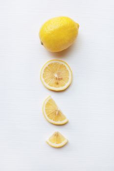 Fresh lemon with slice  on a white background.
