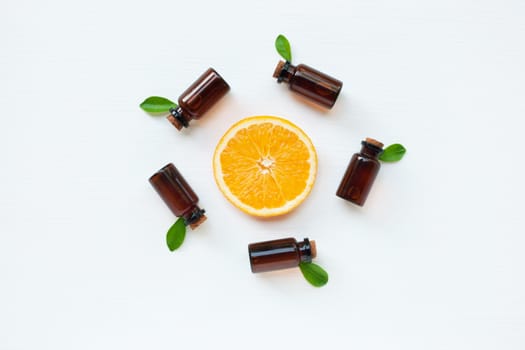 Bottle of essential oil from oranges citrus fruit on white background, Alternative medicine