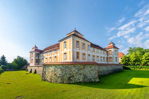 Castle in Slovenska Bistrica, Slovenia in early morning light with defensive stone wall and ditch