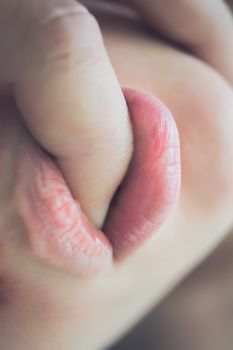 Pretty young woman enjoying with boyfriend, his finger in her mouth