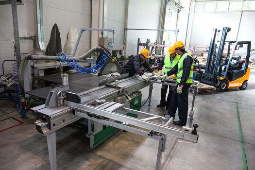CNC machine shop with lathes, technicians and workers