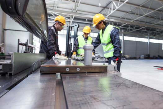 CNC machine shop with lathes, technicians and workers