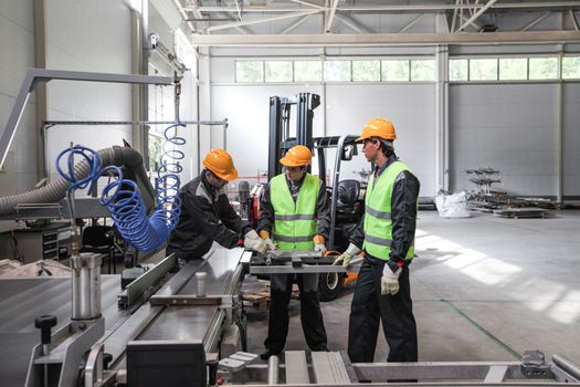 CNC machine shop with lathes, technicians and workers