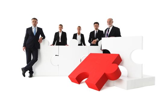 Business team portrait and big puzzle isolated on white background