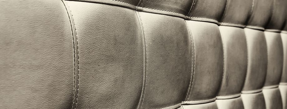 Tufted grey leather headboard texture, used for background