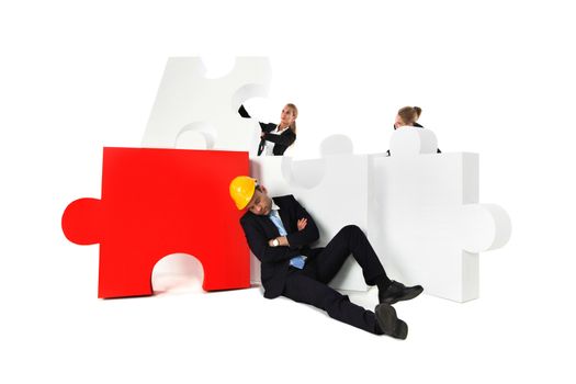 Coworkers look at tired foreman sleeping near puzzle isolated on white background