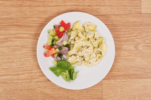 Baked zucchini vegetable salad on a white background