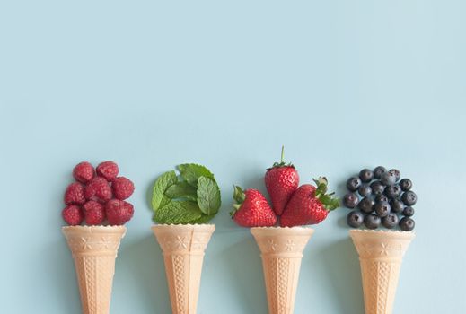 Four icecream cones with natural ingredients including berries, and mint flavors