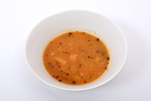 Oyster mushroom soup with vegetables on a white background
