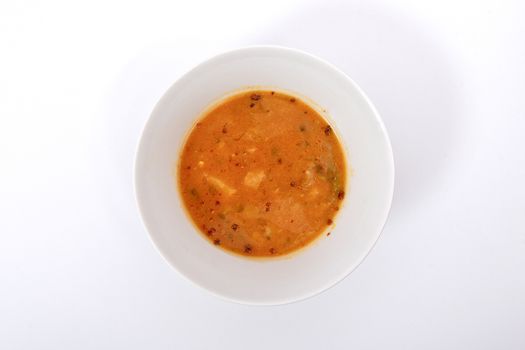 Oyster mushroom soup with vegetables on a white background