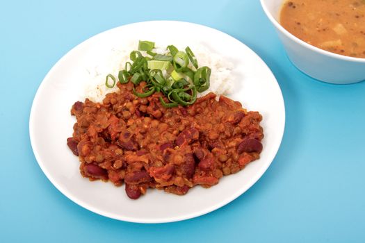 Indian legume hash with rice on a blue background