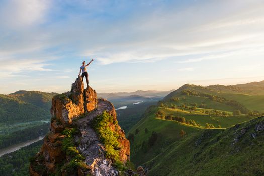 Woman on top mountain in Altai, sunset light, beauty summer landcape