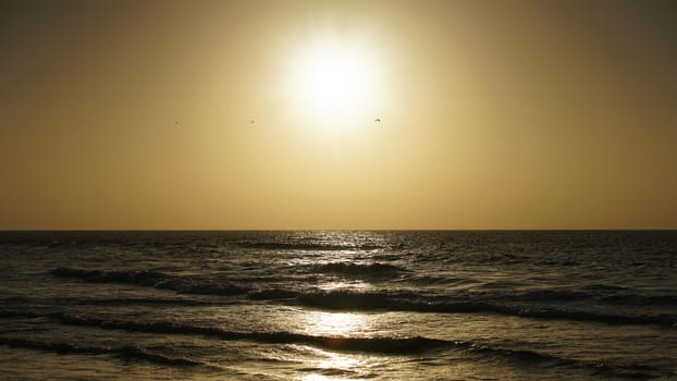 natural sea landscape waves on a sunset background