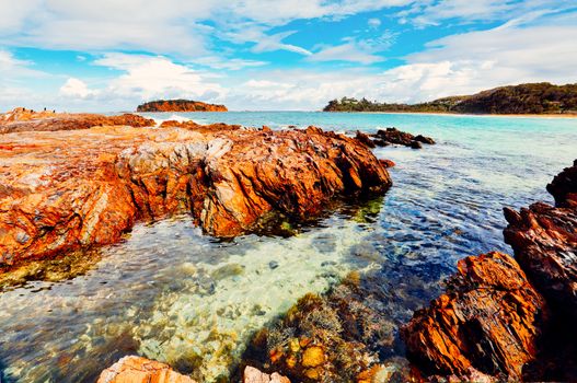 Coastal views from the rocky reef over to a small island offshore.  South Coast Australia