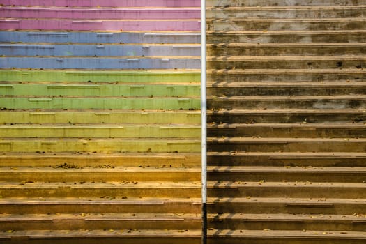 Contrast old stairs with colorful and blank concrete side. Rural Thailand.