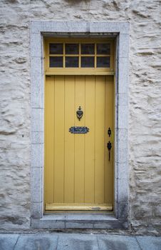 Wooden door entrance in the historical district in Quebec City, Canada