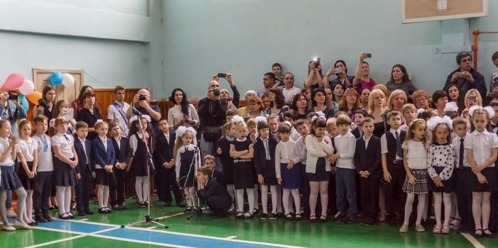 Kiev.Ukraine-May 26,2017: Children schoolchildren on the line on the last bell sing songs, dance, recite poems, perform, receive awards