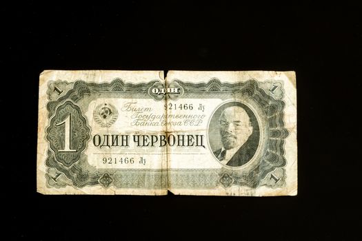 One Ruble bank note, paper note with portrait of Vladimir Lenin, on old Russia ruble banknote macro, close up, isolated on black background