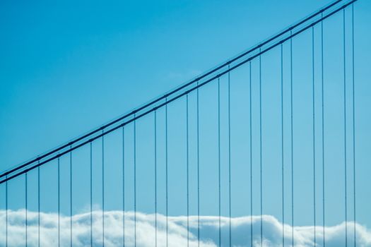 Detail Of Clouds Resting On The Golden Gate Bridge On A Bright Sunny Day With Copy Space