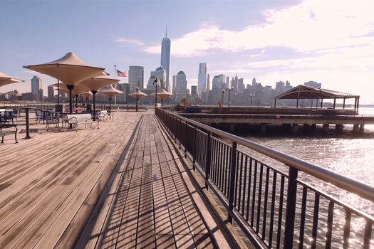 A cafe with a view of the skyscrapers of New York.