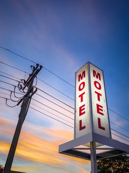 Vintage motel light sign at sunset, New Zealand