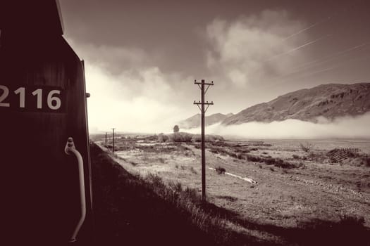 Train in Mountain fields landscape, New Zealand alps