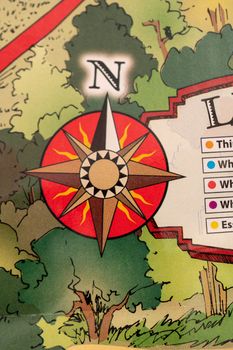 Closeup of travel map with legend and wind rose in form of a compass, travel concept, map detail