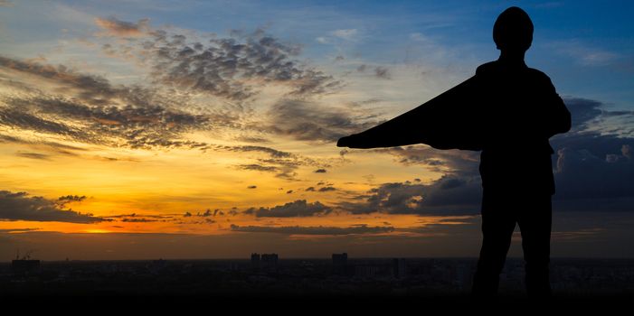 Silhouette of Super businessman at twilight in the city