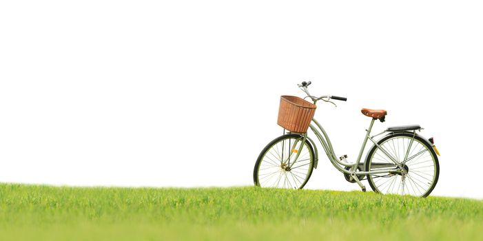 Bicycles on the green grass on white background with Clipping Path