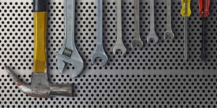 Set of hand tools on metal background