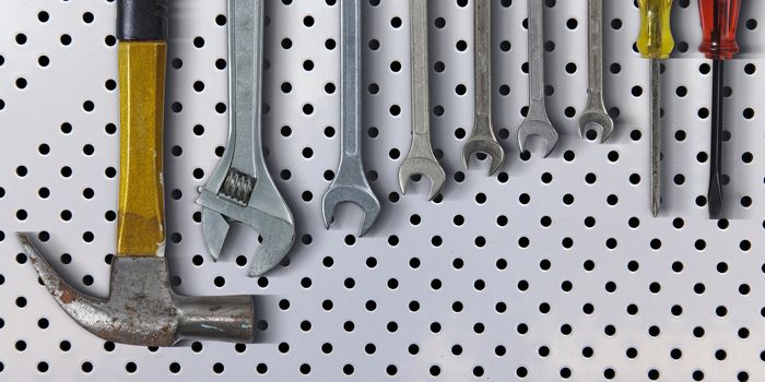 Set of hand tools on metal background