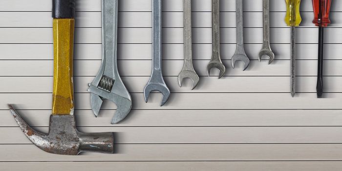 Set of hand tools on metal background