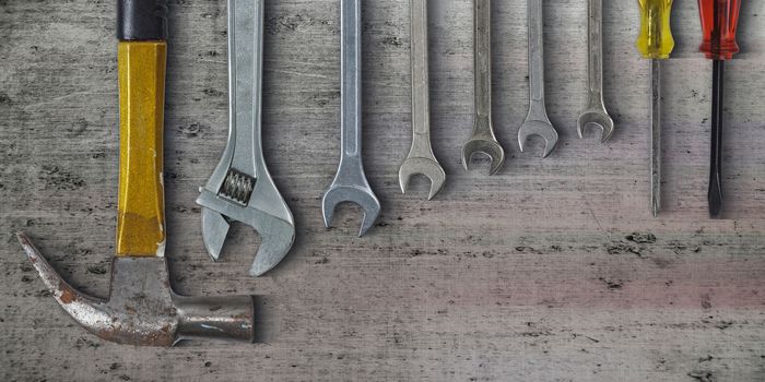 Set of hand tools on metal background