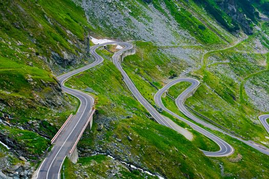 winding serpentine of the TransFagarasan road. beautiful transportation background. popular tourist destination in Romania