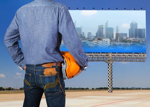 Cropped view of construction worker with orange helmets at workplace on construction site