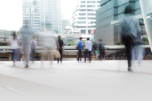 People walking in motion blur in the city