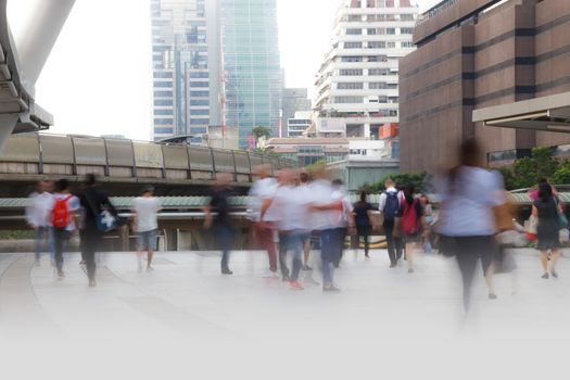 People walking in motion blur in the city