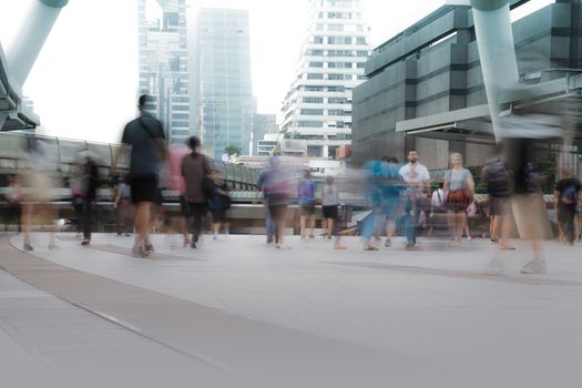 People walking in motion blur in the city