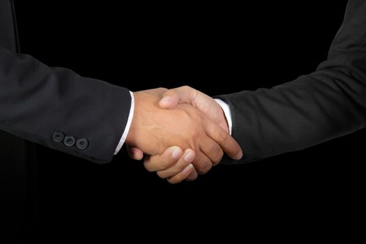 Businessman handshake, Successful businessmen handshaking on black background