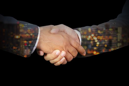 Double exposure of Businessman handshake, Successful businessmen handshaking in a modern office blurred background