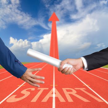 Cropped hand of businessman passing relay baton to colleague, the concept of teamwork for business success on running track