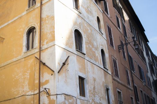 old buildings in Rome with contrast between lights and shadows