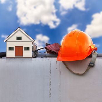 Construction helmet, Construction Tools and Little House on Construction site